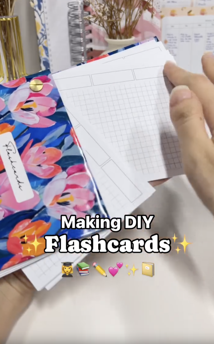 Finished set of DIY flashcards fanned out on a single Chicago screw with chipboard covers