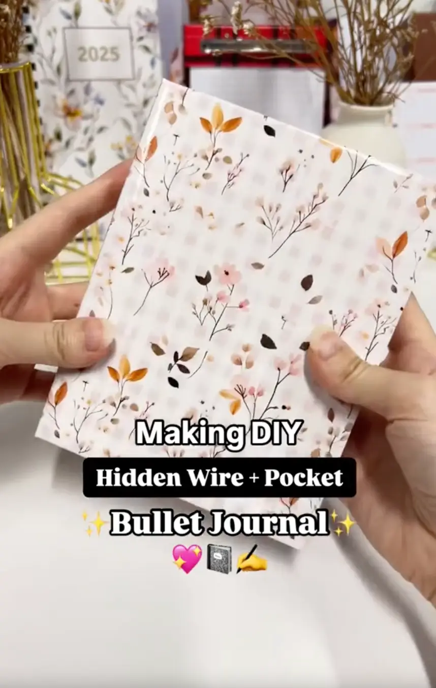 Finished DIY pocket bullet journal with hidden wire binding and a cover pocket