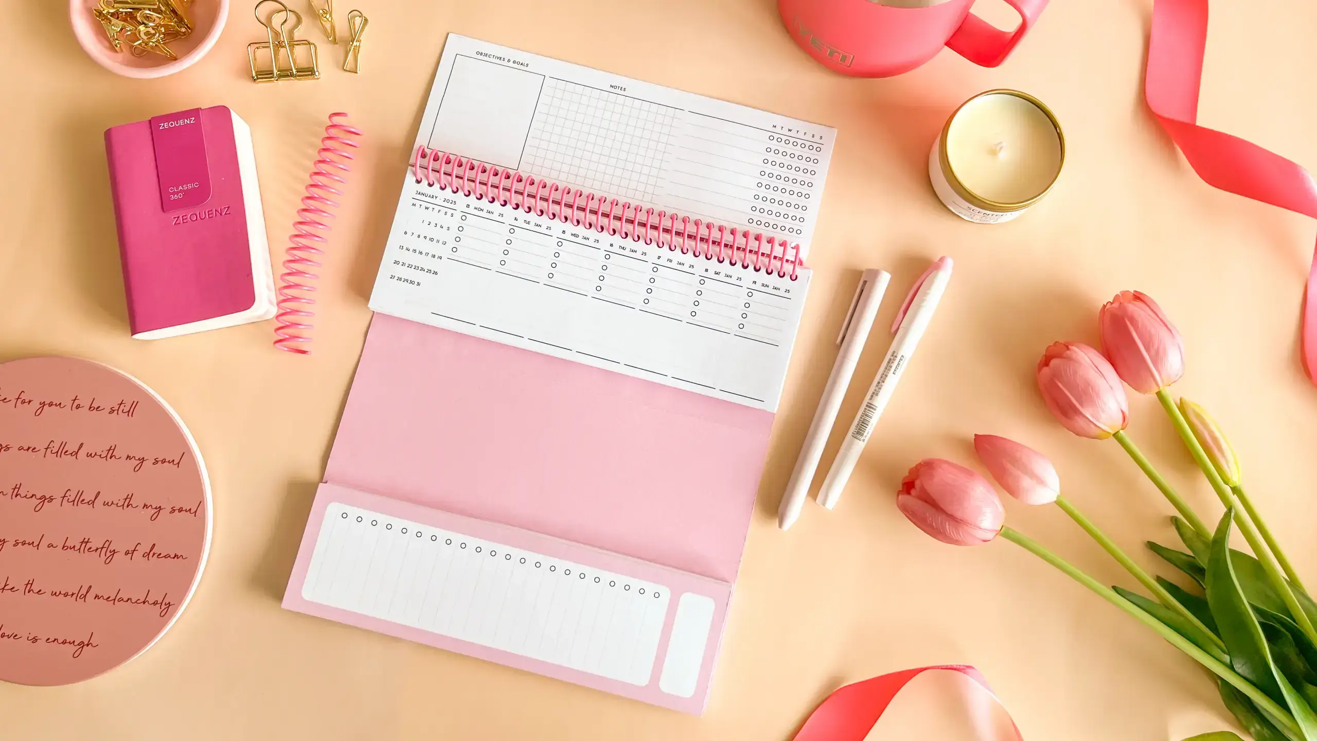 A weekly desk planner spread showing all seven days at a glance