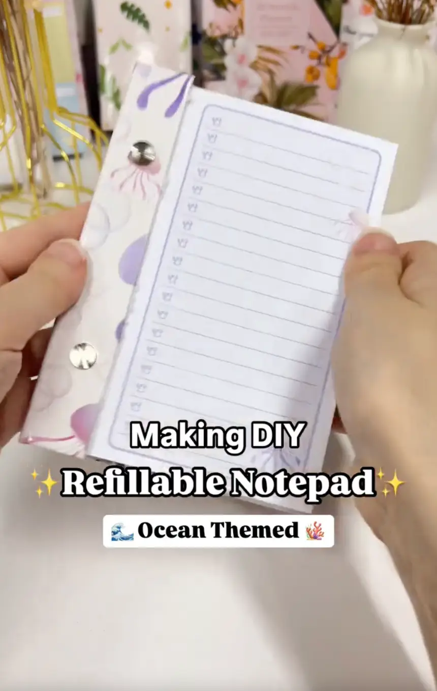 Finished DIY refillable notepad with a chipboard hard cover and Chicago screws