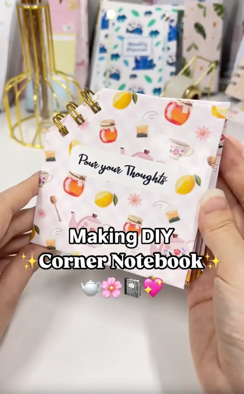 Finished DIY corner notebook bound diagonally through one cut-off corner