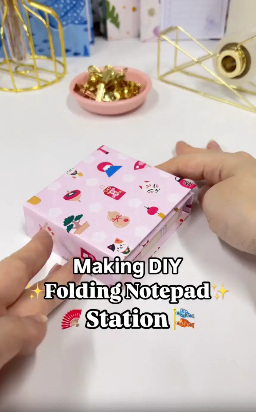 Finished DIY folding notepad station open with three small notepad sections