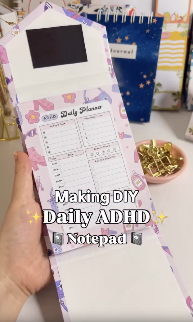 Finished DIY daily ADHD notepad with a folding chipboard cover held shut by magnets