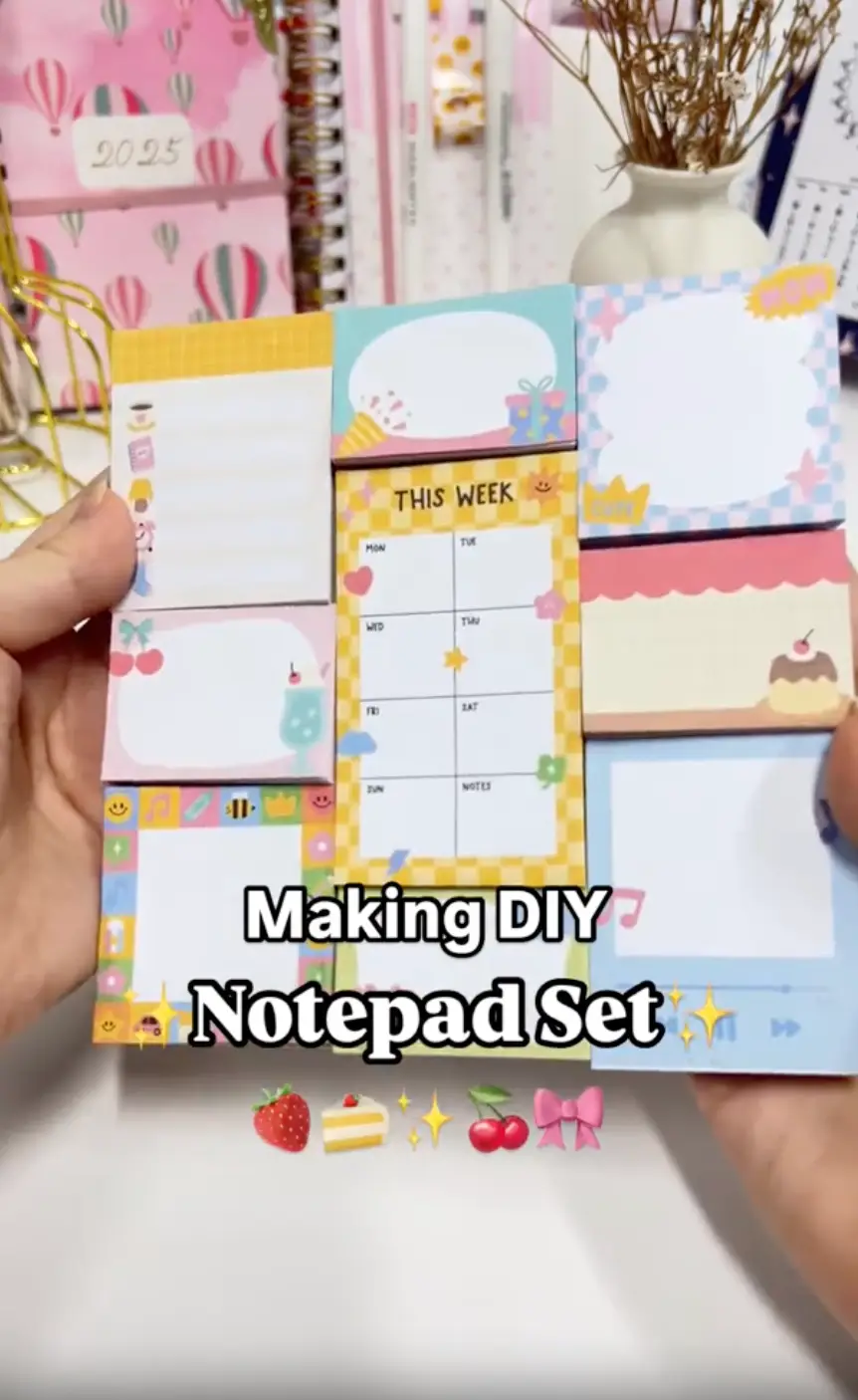 Finished DIY notepad set of nine mini notepads arranged on a chipboard base